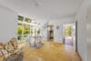 Stilvolles Reihenendhaus mit Wintergarten, Süd/Westgarten und architektonischem Charme - Livingbereich mit Küche und Dielenbereich